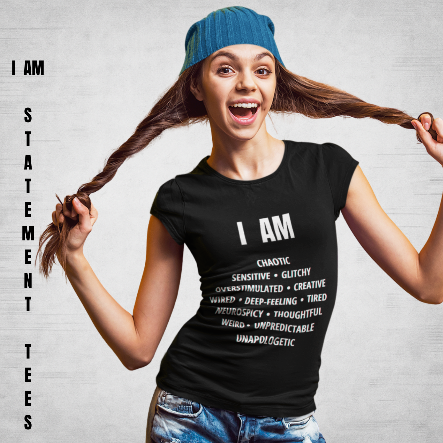 Smiling young woman wearing black "I AM Statement" t-shirt featuring bold white text listing 13 neurodivergent traits, styled with a blue beanie — Mentally Glitched brand.