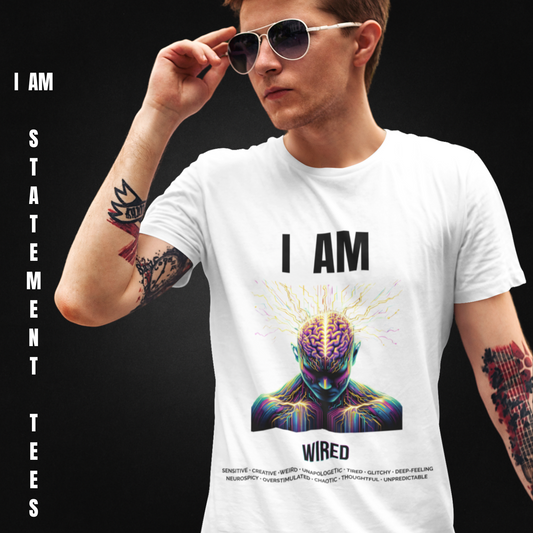Man wearing I AM WIRED t-shirt by Mentally Glitched. White shirt featuring a stylized glitchy brain portrait and a list of neurodivergent traits. Statement tee for wired minds.