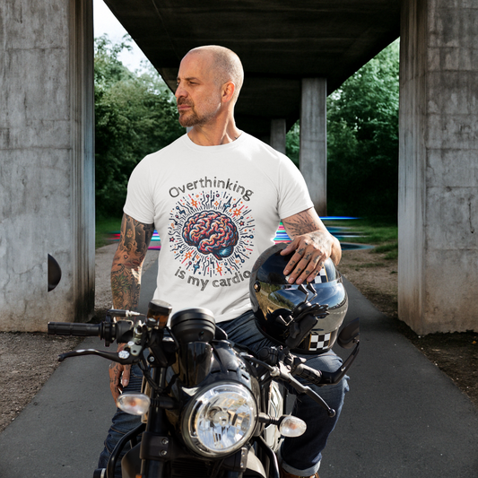 Man holding a helmet and standing next to a motorcycle while wearing the "Overthinking Is My Cardio" t-shirt – calm yet bold attitude.